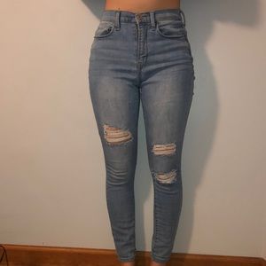 Ripped high rise blue jeans